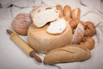 Fresh homemade bread in a cotton cloth background
