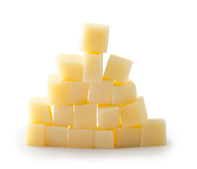 Parmesan cheese cubes on a white background with clipping path. Pyramid.