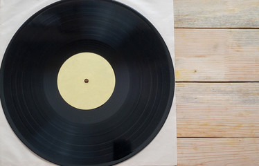 Vinyl record with copy space in front of a collection albums dummy titles, vintage process