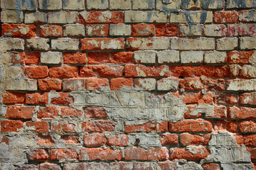 texture of old dilapidated shabby brickwork of red brick wall fo