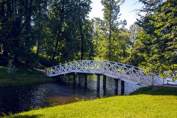 Fototapeta na wymiar white wooden bridge on the river