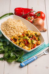 couscous with fresh salmon zucchinis tomato and capsicum