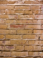 Textured background closeup. Rufous old brick wall, abstraction