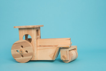 Wooden Tractor on blue background