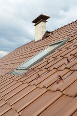 New roof with skylight, natural red tile and chimney