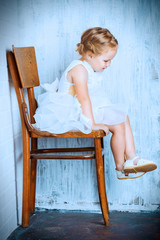 child on a chair
