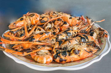 grilled prawns on dish
