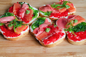 Sandwiches with seafood on board.