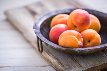 rustic bowl with fresh ripe nectarines