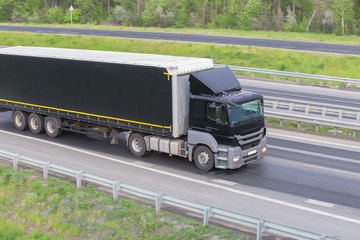 Fototapeta na wymiar truck moves on highway