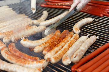 Street fast food, grilled sausages at bbq