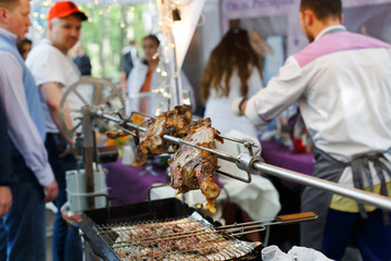 Lamb leg roasted at spit, meat barbecue