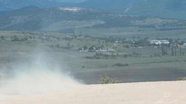 Participants of Motocross Competitions Pass Turning at High Speed, Leaving a Trail of Dust