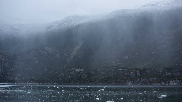 Mountains, rainfall and mist near Amalia Glacier, Chile.