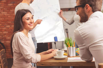 Joyful creative team is working in cooperation