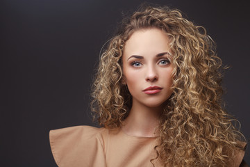 Portrait of perfect woman with curly hair