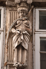 Fototapeta premium Strangled art, air-conditioning pipe over an ornamental state, Bucharest, Romania