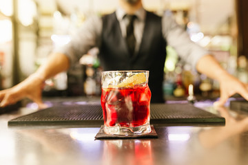 Barman is making cocktail at night club. - obrazy, fototapety, plakaty