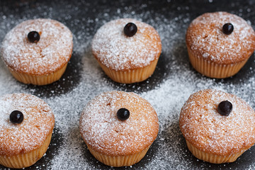 Muffins with black currant sprinkled