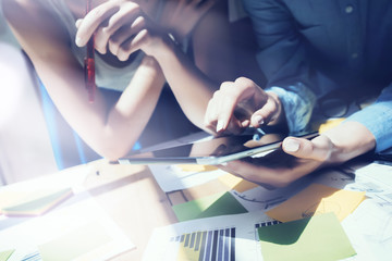 Close up photo Girl Touching Screen Digital Tablet Hand.Project Producers Researching Process.Young Business Crew Working New Startup modern Studio.Analyze market stock.Blurred,flare effect.Horizonta