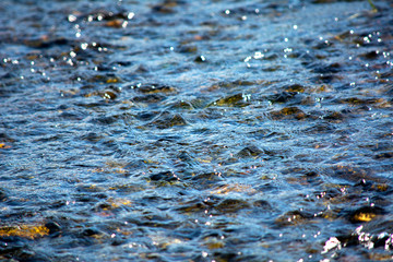 Ripples on the water of mountain river