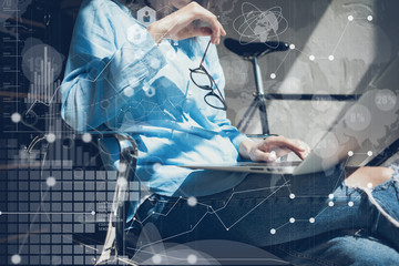 Woman Using modern Laptop Hand.Project Manager Researching Process.Business Team Working Startup Design Loft Studio.Global World Wide Icon Interfaces.Innovations Graphs.Analyze market stock.Blurred..