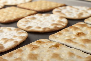 Close up of assorted crackers on a baking tray