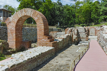Fototapeta na wymiar Ruins of Entrance and panorama of The ancient Thermal Baths of Diocletianopolis, town of Hisarya, Plovdiv Region, Bulgaria