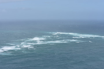At Cape Reinga Tasman sea meets Pacific ocean.