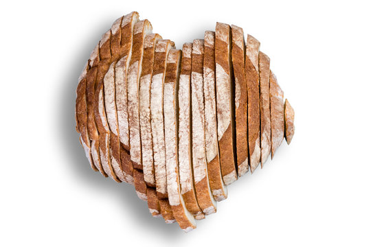 Sliced bread in shape of heart over white