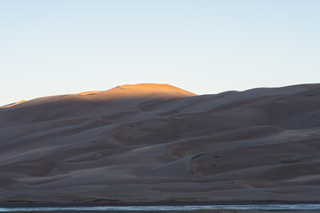 Fototapeta na wymiar First Light Hits the Dunes