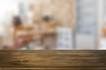 Selected focus empty brown wooden table and space of Coffee shop