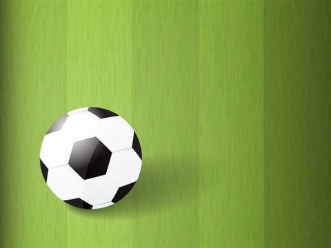 soccer ball on green field with copy space