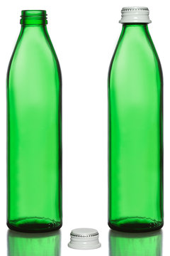 an empty green bottle with lid and without