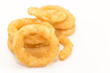 Deep fried onion ring on white background with copy space.