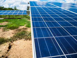 Solar panels with blue sky and clouds