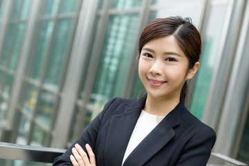 Young Businesswoman stanidng outside