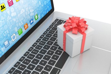 Gift box with ribbon on laptop keyboard. 3d rendering.