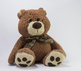 Brown classic style teddy bear on with background