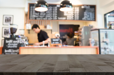 Obraz premium Selected focus empty brown wooden table and Coffee shop blur bac