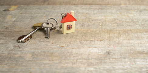 Closeup of keys on blueprint of new home. copy space