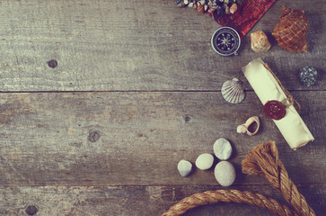 Travel items on wooden table. Summer time sea vacation background. Top view