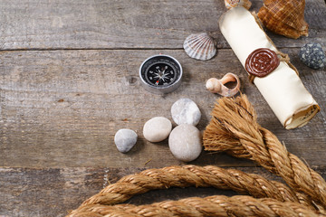 Travel items on wooden table. Summer time sea vacation background. Top view