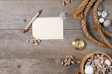 Travel items on wooden table. Notebook blank page mock-up