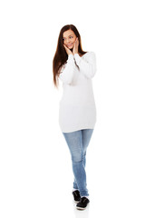 Young beautiful smiling surprised woman