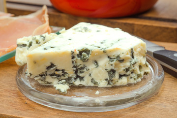 piece of blue cheese on wooden