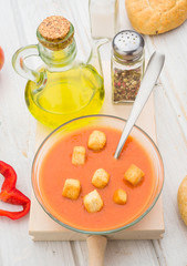 aerial view of gazpacho soup with croutons in round bowl