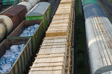 trains with industrial goods stand on the rails