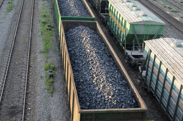 trains with industrial goods stand on the rails