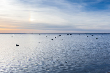 Yacht swimming in Baltic sea at sunset